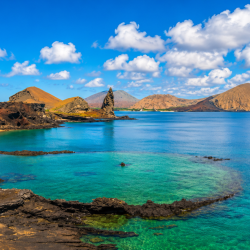 Panoramic landscape of Bartolomé Island in the Galápagos with volcanic hills and ocean views